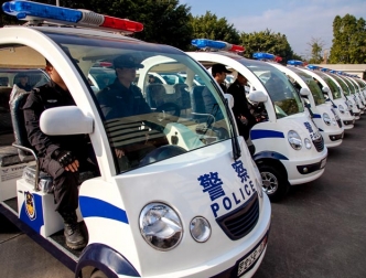 Luoding Public Security Bureau police vehicles on site.